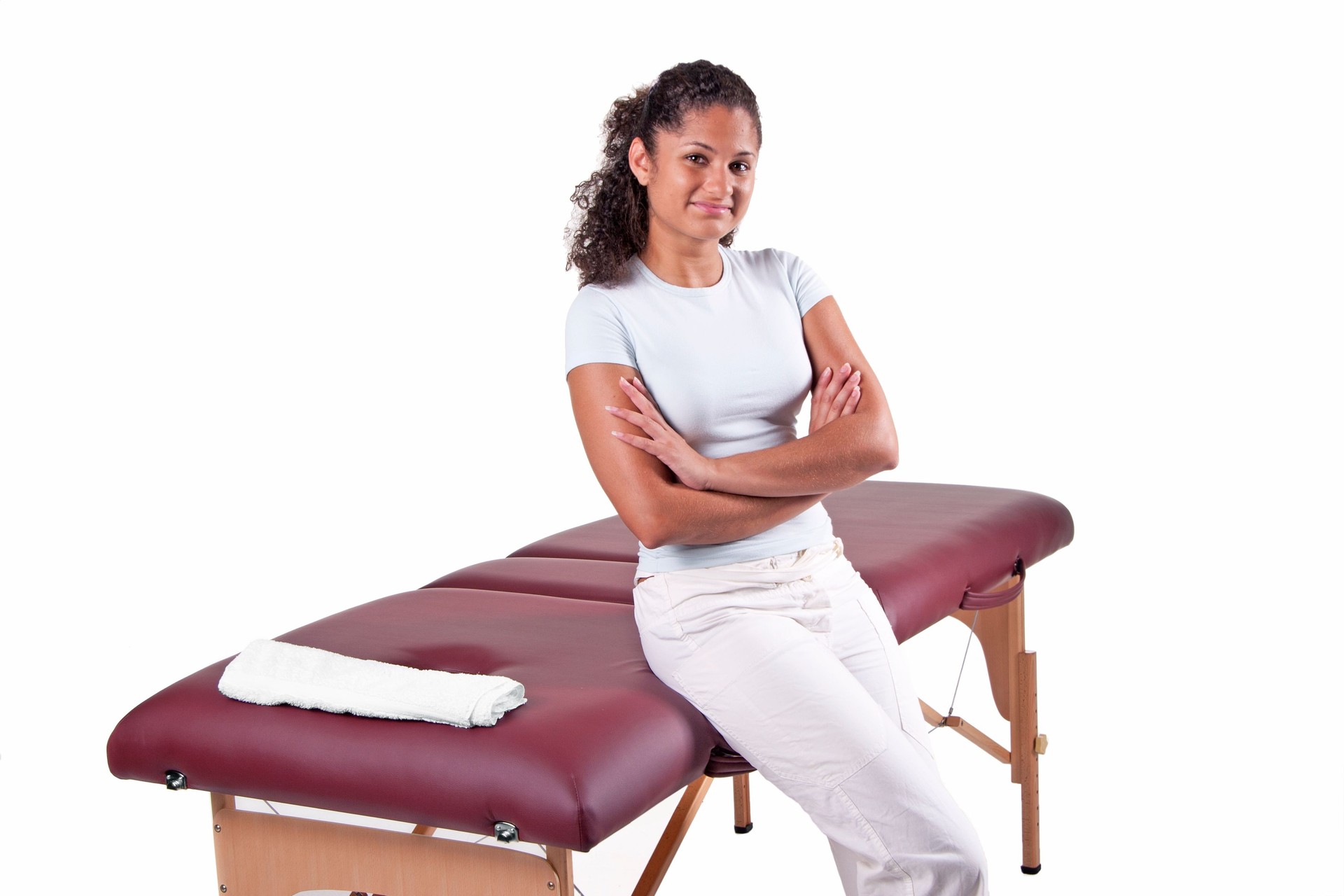 Massage table with proud masseuse